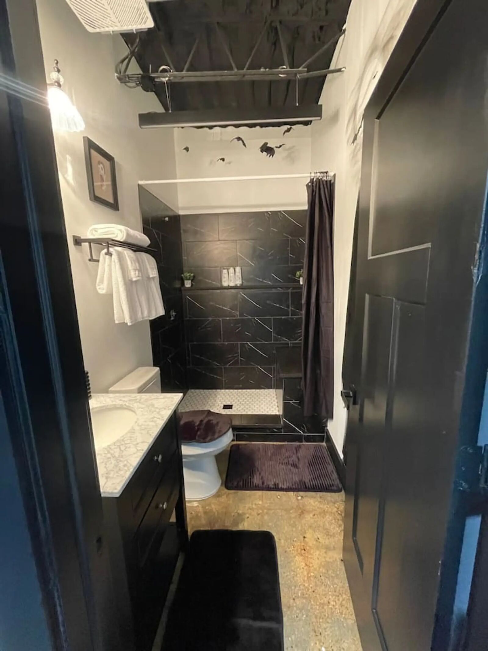 Ghostbusters themed bathroom with bats and horror decor